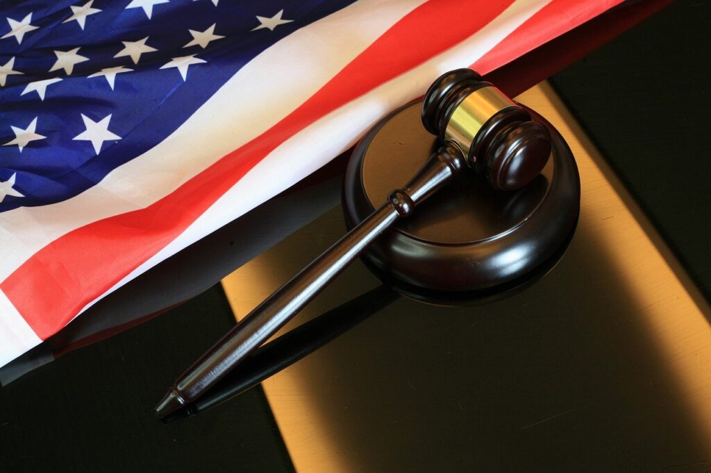 A gavel next to an American flag