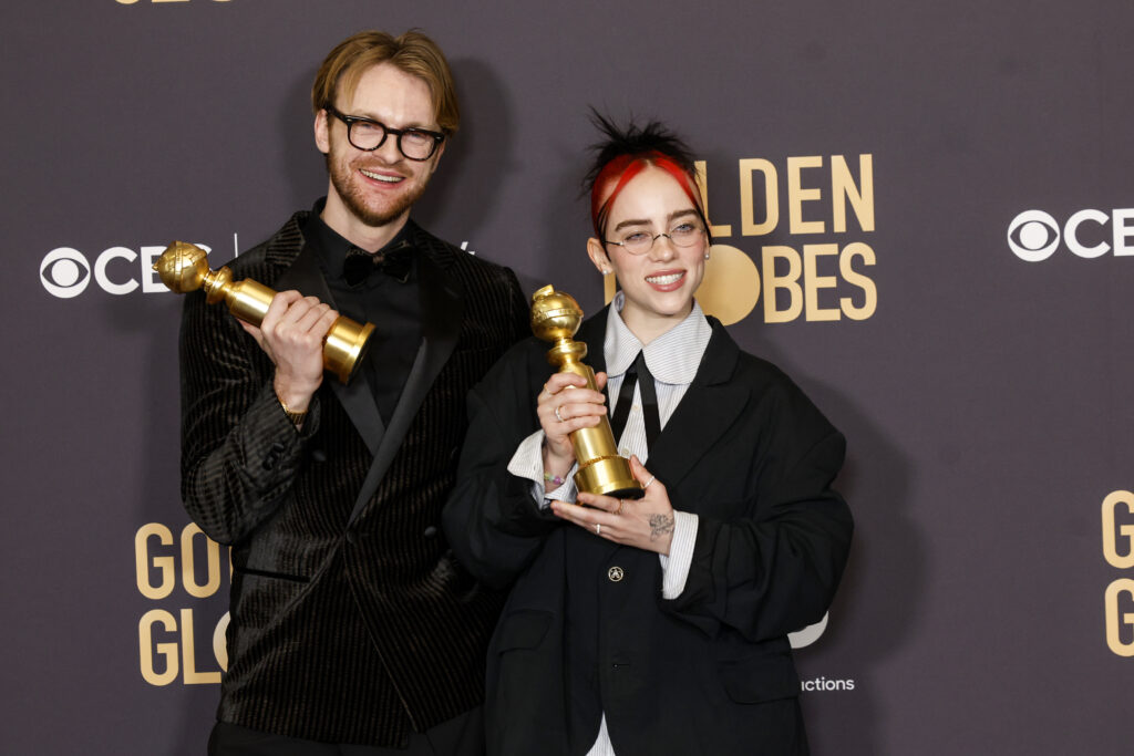 Musicians Billie Eilish (R) and Finneas O'Connell pose with the award for Best Original Song - Motion Picture "What Was I Made For" from the movie "Barbie" in the press room during the 81st Annual Golden Globe Awards held at the Beverly Hilton Hotel on January 7, 2024. 