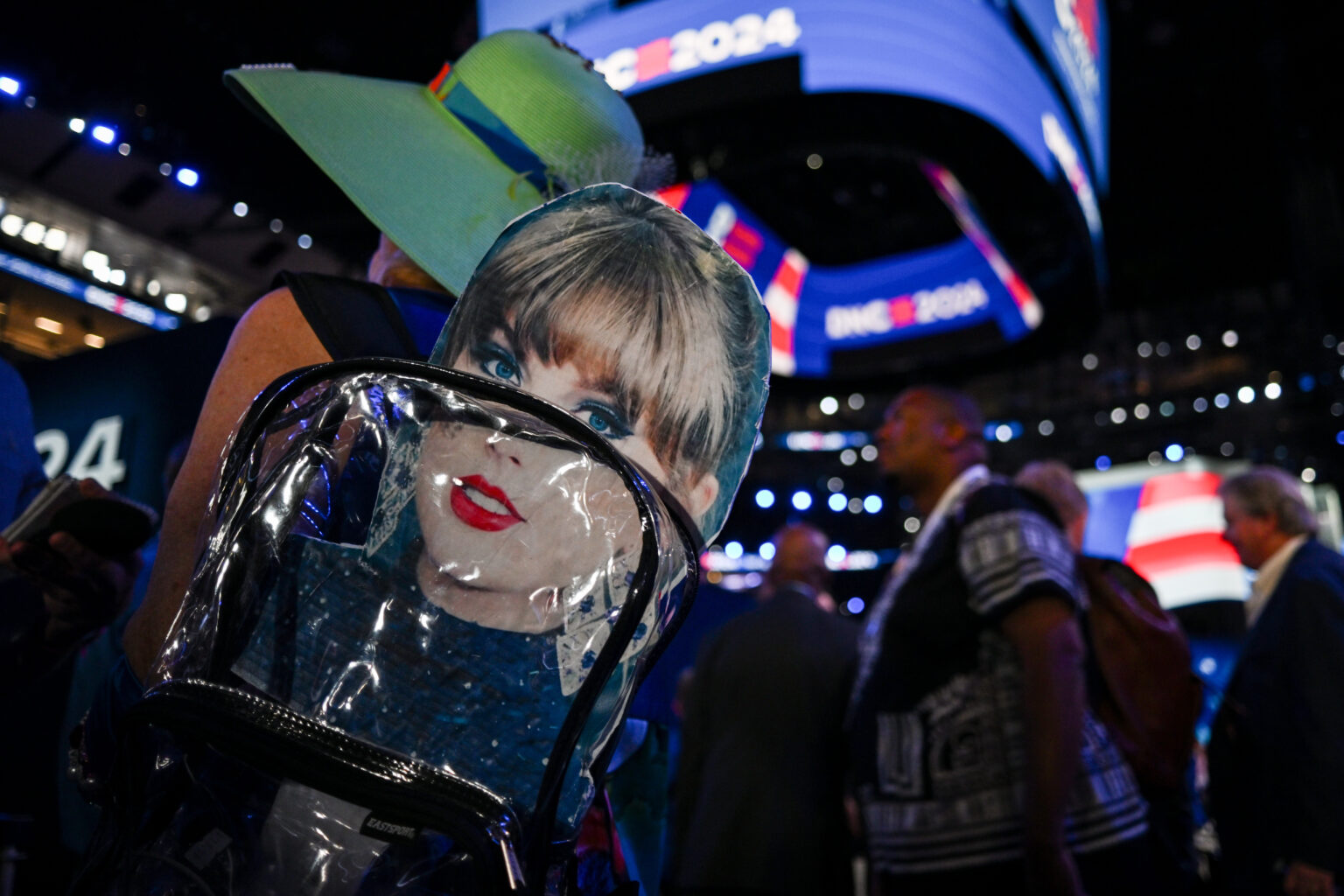 CHICAGO, ILLINOIS - AUGUST 21: An attendee wears a backpack with a Taylor Swift sign during the third day of the Democratic National Convention at the United Center on August 21, 2024 in Chicago, Illinois. Delegates, politicians, and Democratic Party supporters are in Chicago for the convention, concluding with current Vice President Kamala Harris accepting her party's presidential nomination. The DNC takes place from August 19-22.