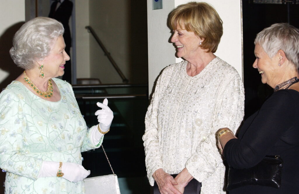 LONDON, UNITED KINGDOM - NOVEMBER 08:  Queen Elizabeth II Chatting With Actresses She Had In The Past  Conferred With Damehood, Dame Judi Dench (in Black) And Dame Maggie Smith At The Royal Film Performance Of 'ladies In Lavender' At The Odeon Cinema In Leicester Square  