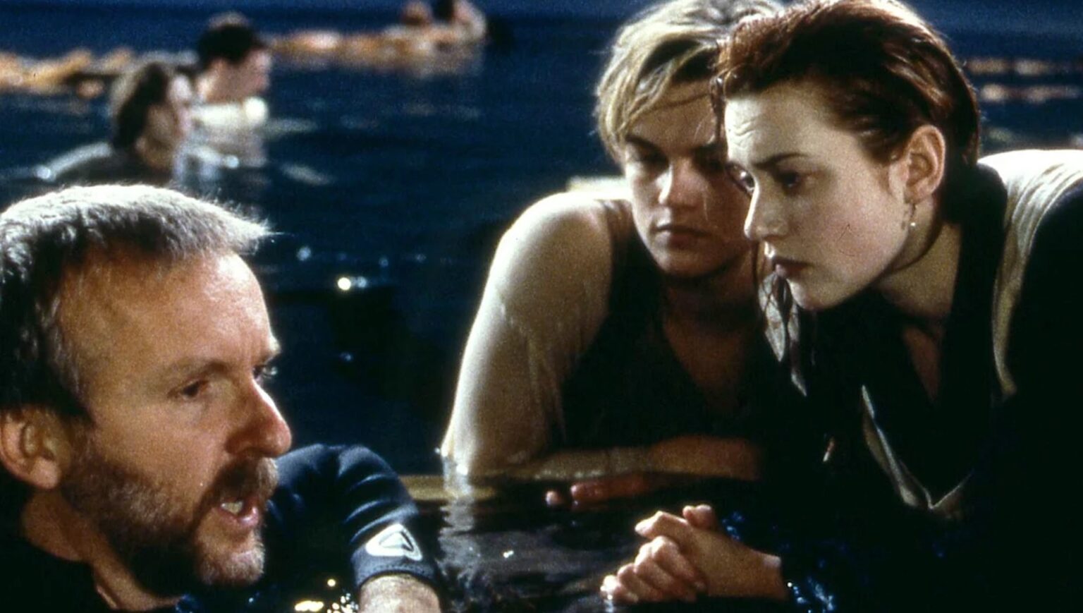 Leonardo DiCaprio and Kate Winslet talking with James Cameron during the door scene in 'Titanic'