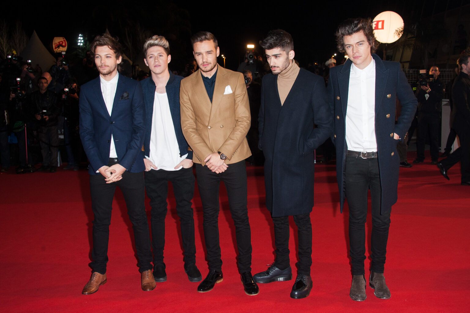 CANNES, FRANCE - DECEMBER 14: (R-L) Harry Styles, Zayn Malik, Liam Payne, Niall Horan and Louis Tomlinson of One Direction attend the 15th NRJ Music Awards at Palais des Festivals on December 14, 2013 in Cannes, France.