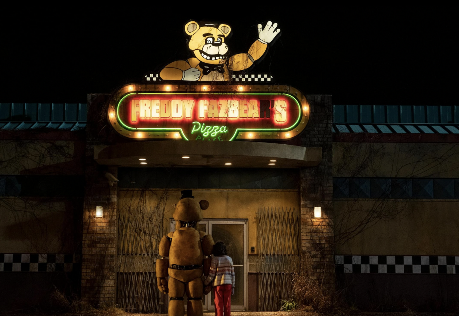 Abby and an animoatronic caharacter from Friday Night At Freddy's stand in from Freddy Fazbera's Pizza entrance at night