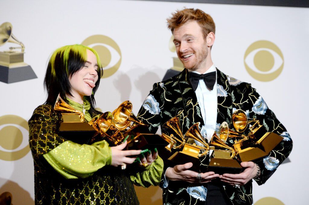 LOS ANGELES, CALIFORNIA - JANUARY 26: L-R) Billie Eilish, winner of Record of the Year for "Bad Guy", Album of the Year for "when we all fall asleep, where do we go?", Song of the Year for "Bad Guy", Best New Artist and Best Pop Vocal Album for "when we all fall asleep, where do we go?", and Finneas O'Connell, winner of Best Engineered Album Non-Classical for "when we all fall asleep, where do we go?", Song of the Year for "Bad Guy", and Producer Of The Year Non-Classical pose in the press room during the 62nd Annual GRAMMY Awards at Staples Center on January 26, 2020 in Los Angeles, California. 