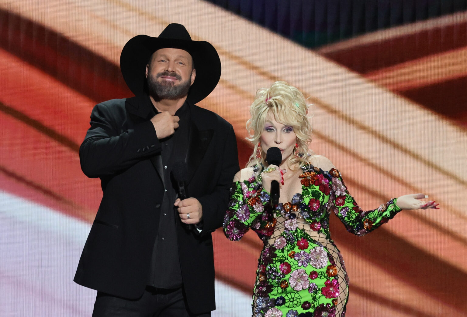 FRISCO, TEXAS - MAY 11: (L-R) Co-hosts Garth Brooks and Dolly Parton speak onstage during the 58th Academy Of Country Music Awards at The Ford Center at The Star on May 11, 2023 in Frisco, Texas.