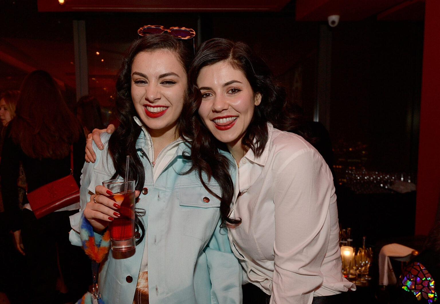 LONDON, ENGLAND - NOVEMBER 11: Charli XCX and Marina Diamandis attend as Sushisamba celebrates its second anniversary with a performance by Lily Allen and a VIP party at Sushi Samba on November 11, 2014 in London, England.