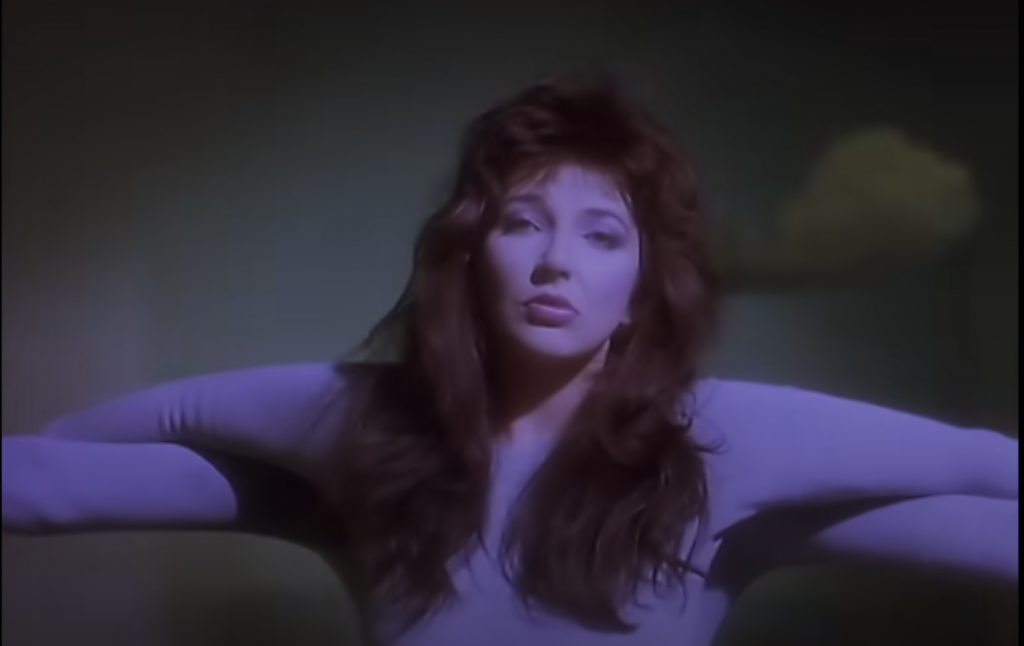 Kate Bush in Running Up That hill video with dancer Michael Heivasu