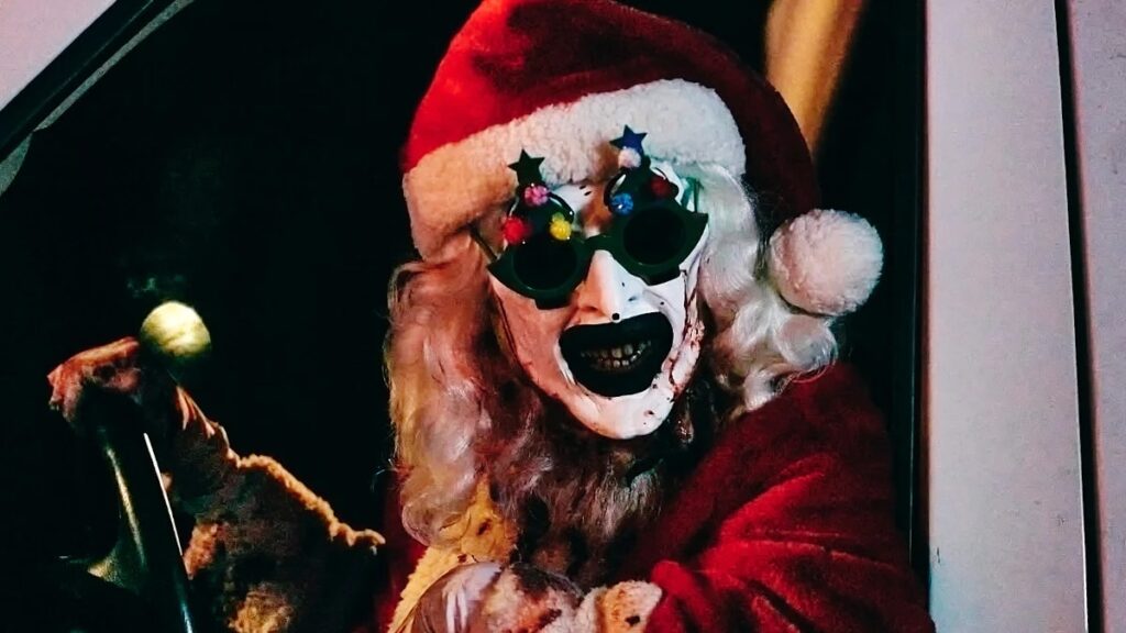 Art the Clown in a Santa suite driving a van in 'Terrifier 3;' Indie Horrors Dominating Studio Blockbusters Is a Great Thing