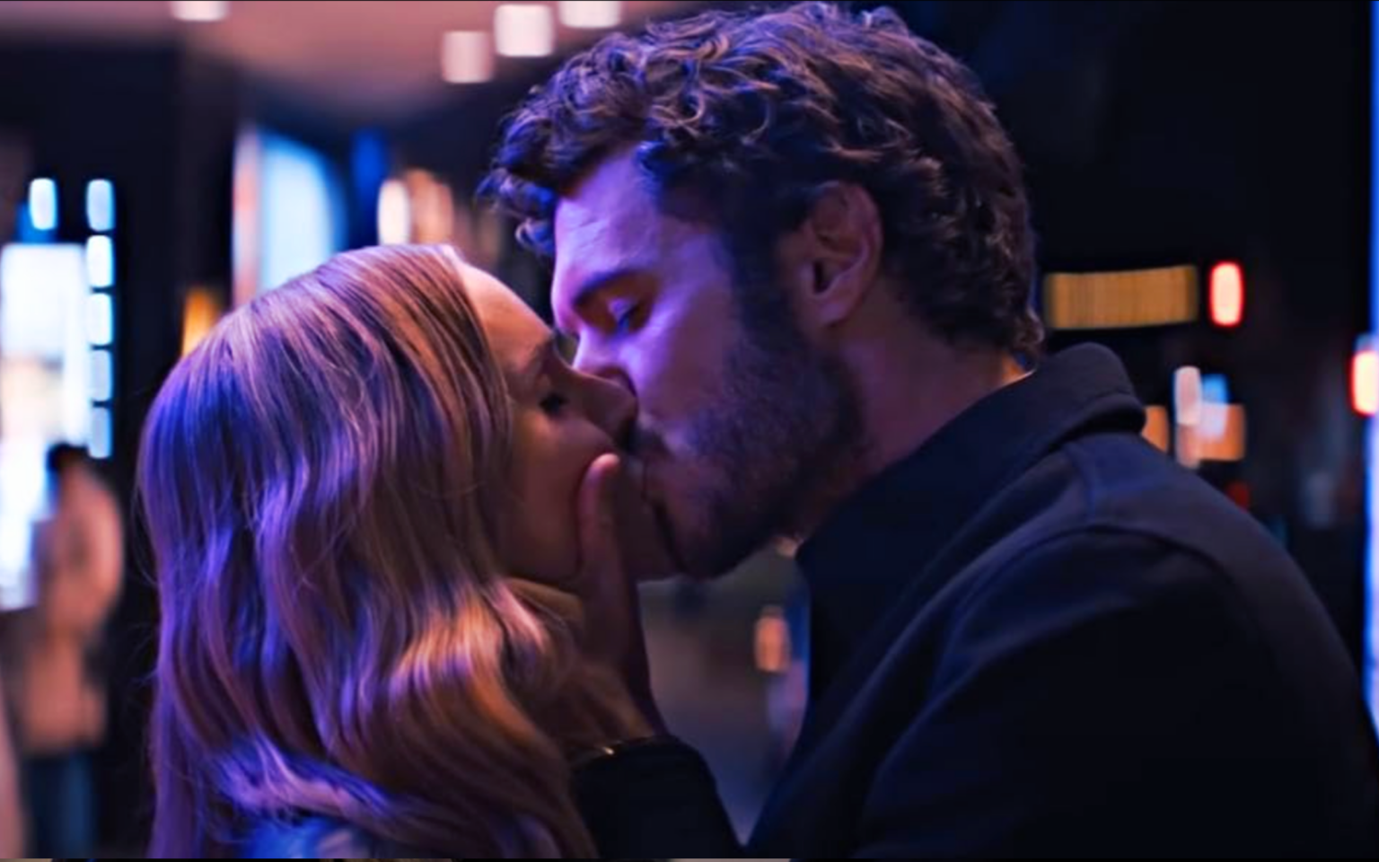 Actors Kristin Bell and Adam Brody kiss in the Netflix show Nobody Wants This