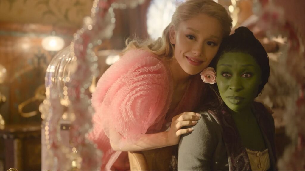 Glinda (Ariana Grande) and Elphaba (Cynthia Erivo) looking in a vanity mirror in "Wicked;" These 5 Broadway Musicals Based on Movies Would Make Great Films