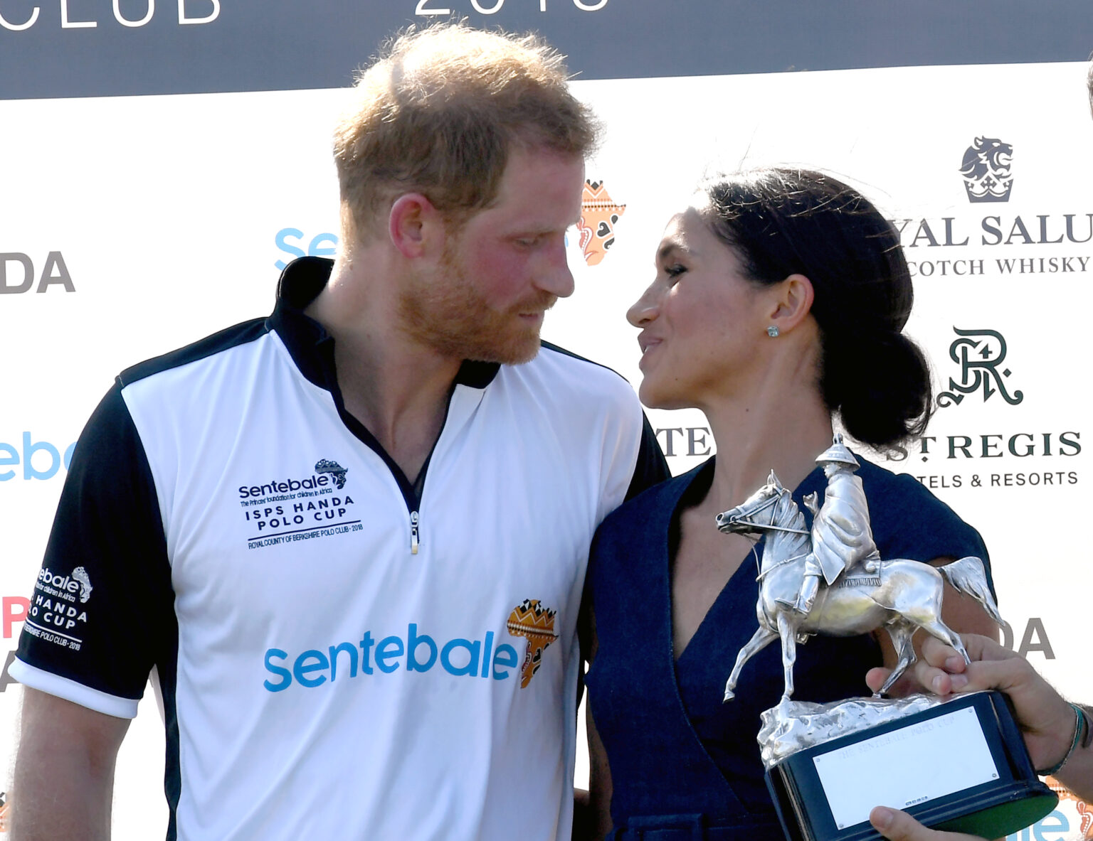 WINDSOR, UNITED KINGDOM - JULY 26: Meghan, Duchess of Sussex and Prince Harry, Duke of Sussex pose with the trophy after the Sentebale ISPS Handa Polo at the Royal County of Berkshire Polo Club on July 26, 2018 in Windsor, England.